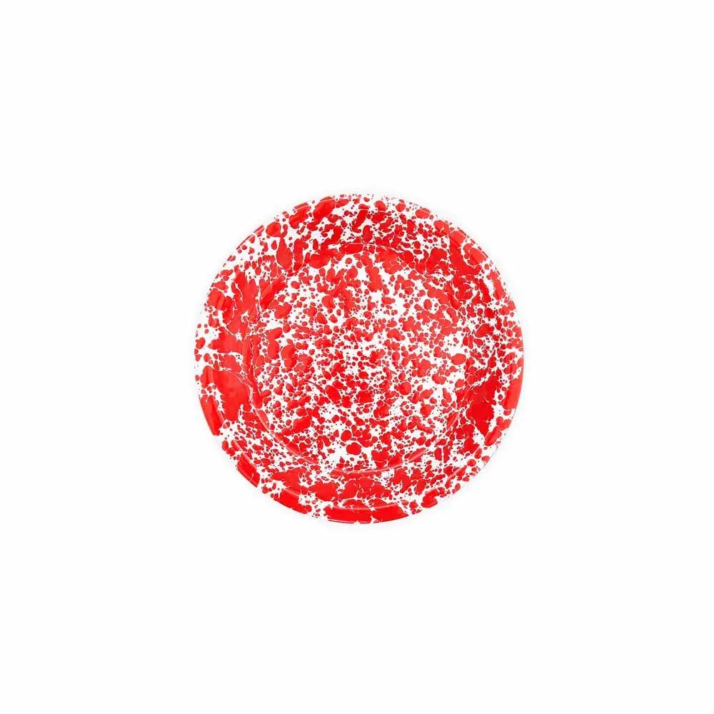 Red pie dish with white speckles on a white background