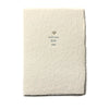 handmade paper cards with soy ink letterpress on recycled cotton paper that reads "welcome little one."