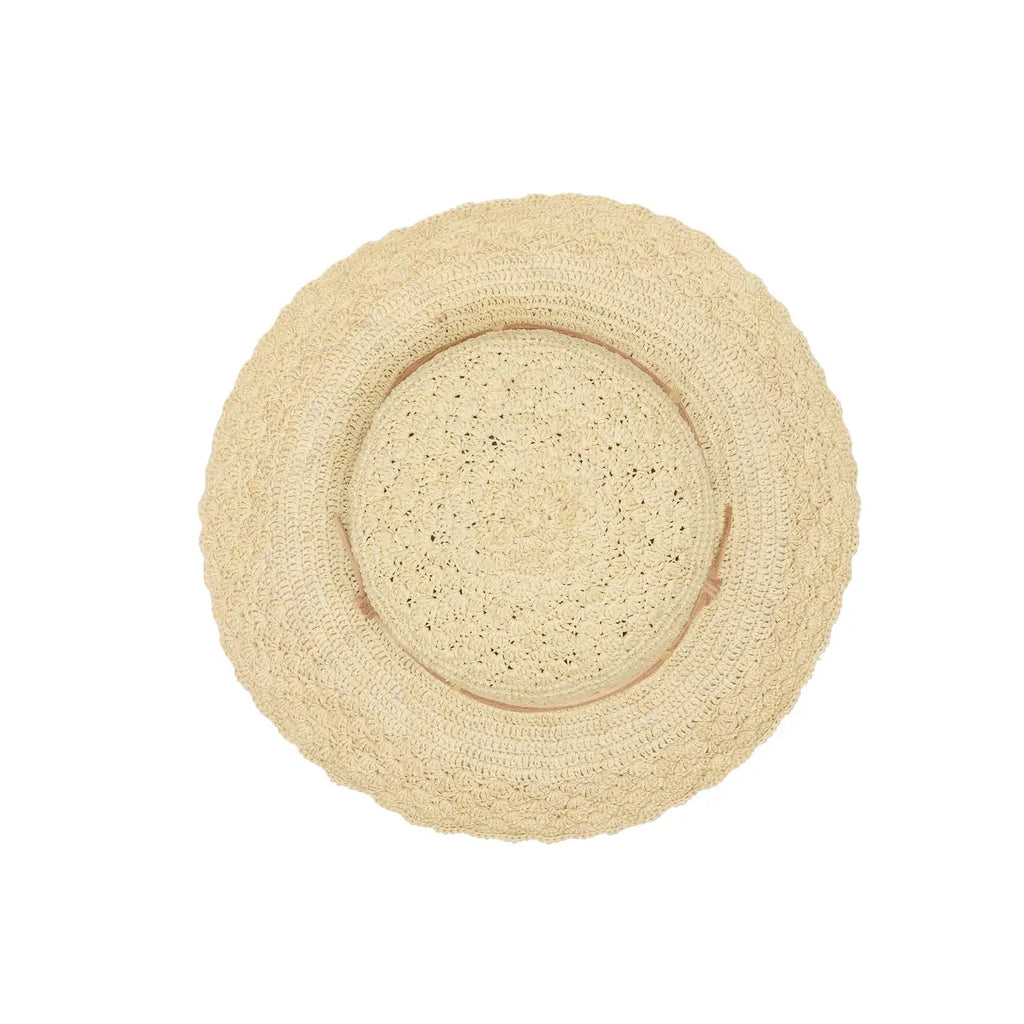 Beige straw hat with a wide brim on a white background, top view