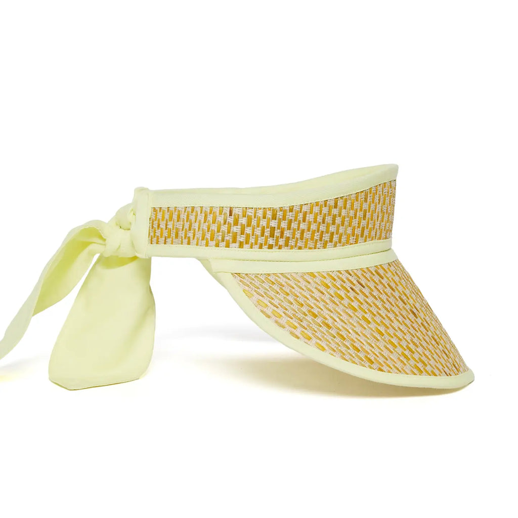 Yellow woven visor with a ribbon on a white background, side view