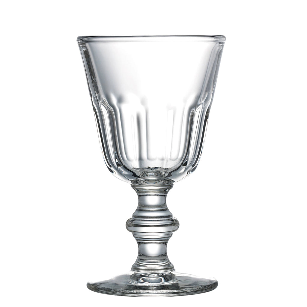 Clear glass goblet with a decorative stem on a white background