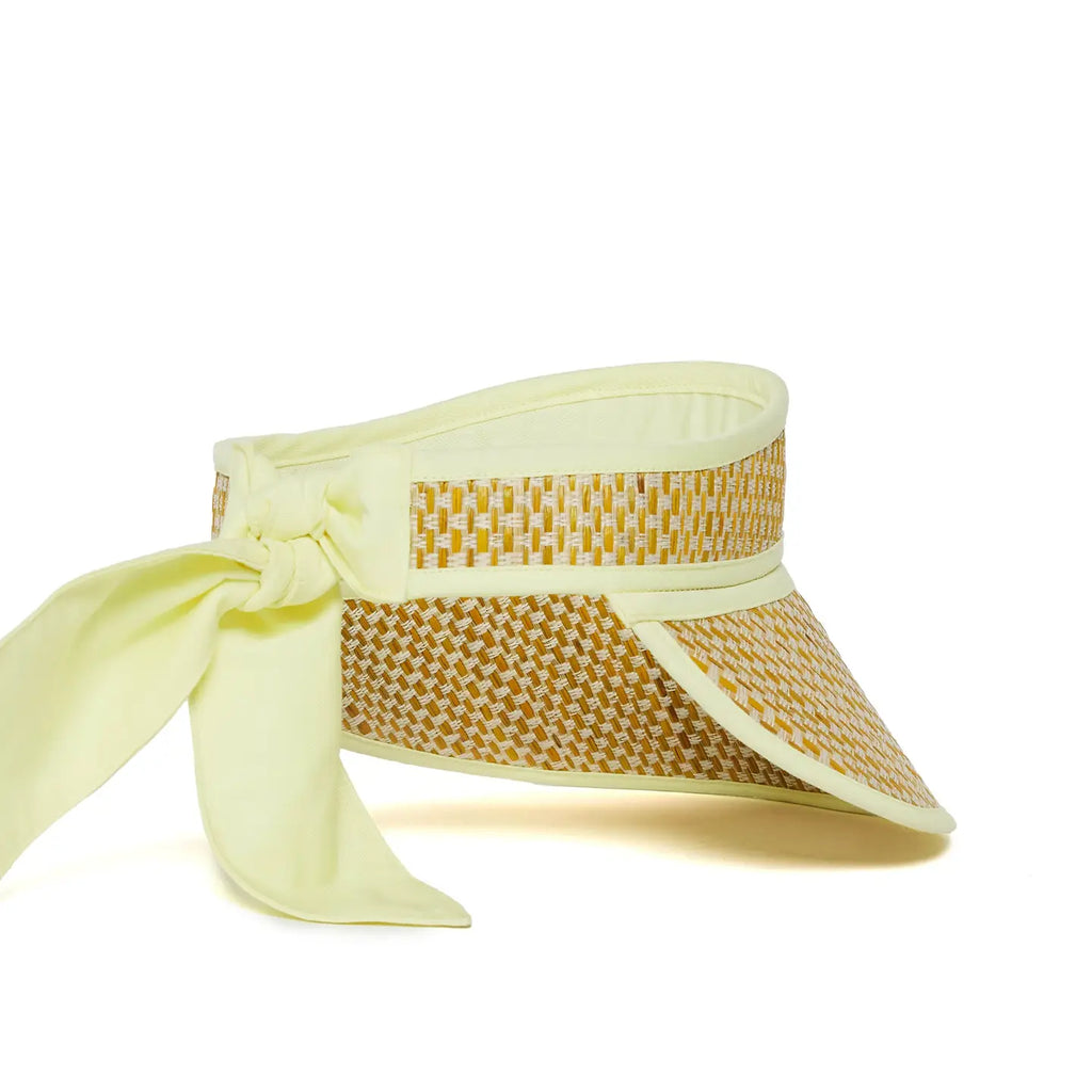 Yellow woven visor with a ribbon on a white background, side view