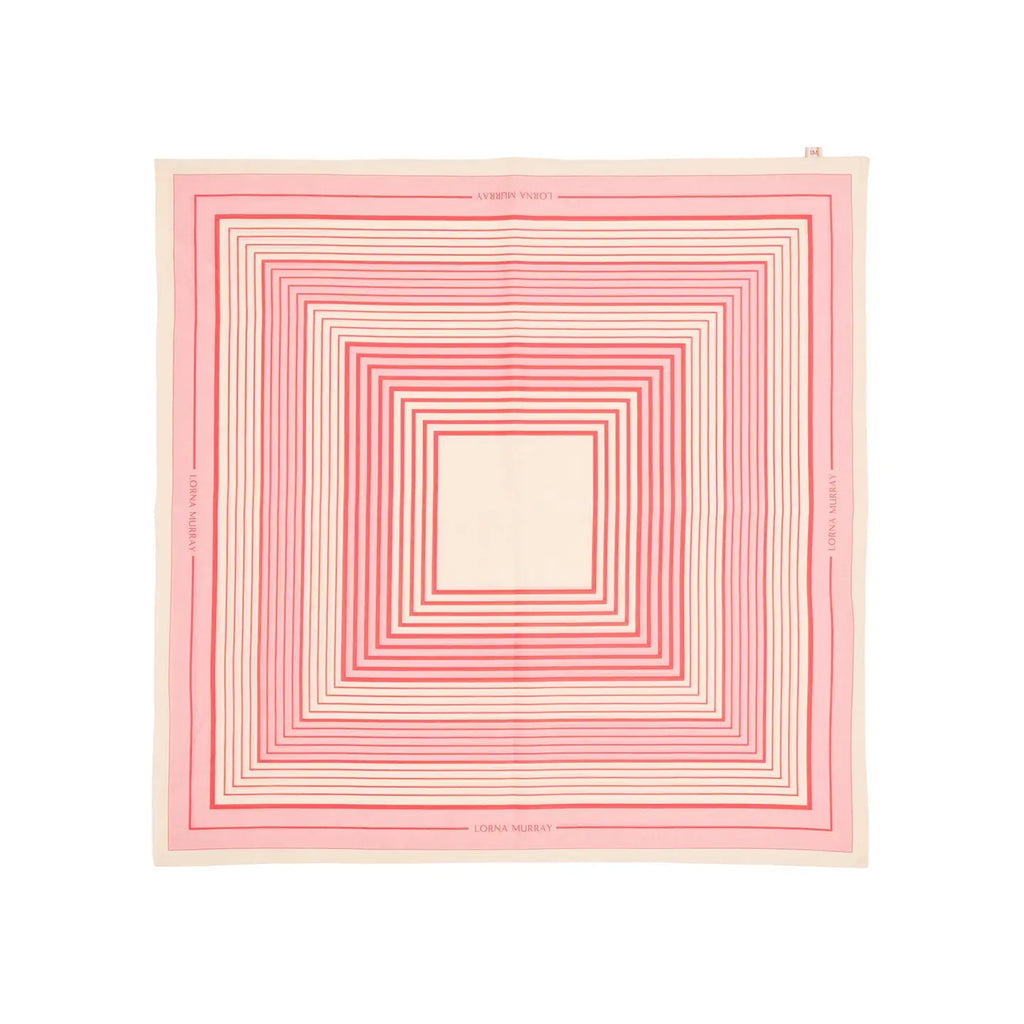 A scarf with a geometric stripe pattern in rose pink, cherry red, and clotted cream colors, displaying the Lorna Murray brand name.