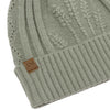 Sage green knit beanie with a brown leather patch on a white background