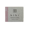 Gray packaging of hibi with pink accent on a white background