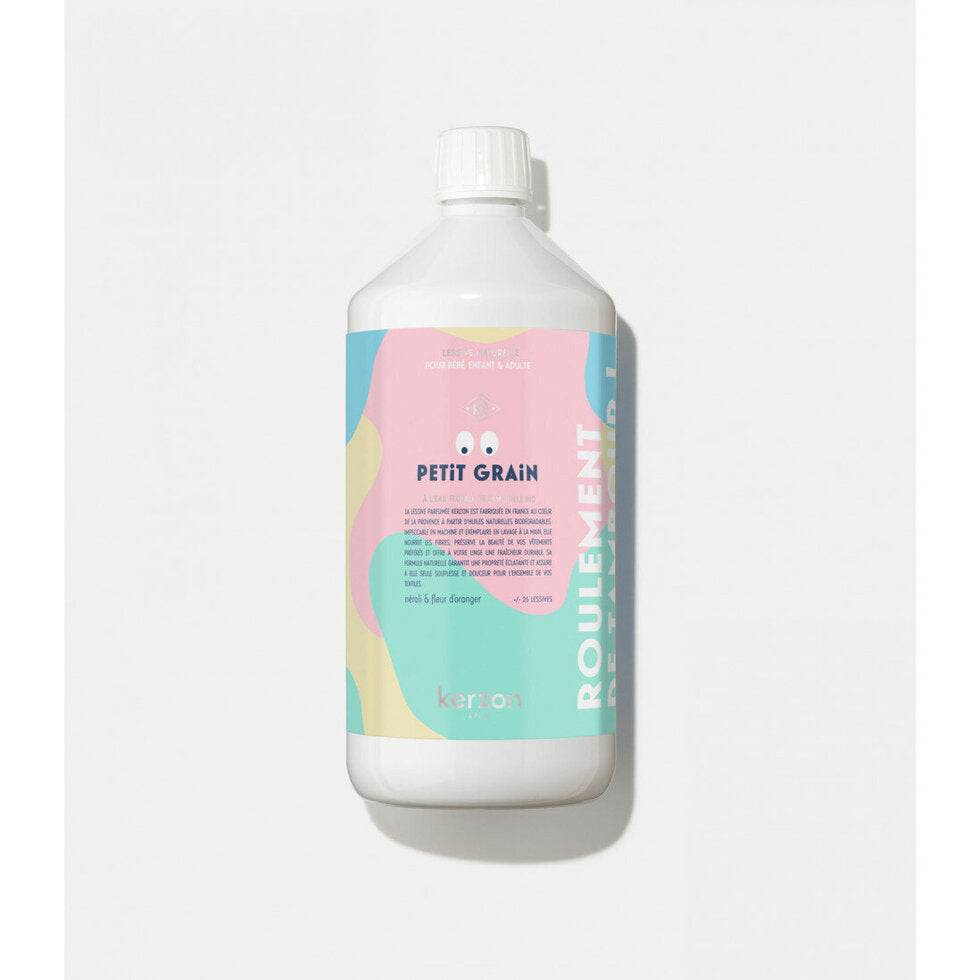Bottle of 'Petit Grain' Kerzon laundry detergent on a light gray background