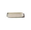 A rectangular ceramic serving platter with rounded corners in a light beige color, shown on a plain white background with a soft shadow.