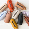 A collection of multicolored Hydration Tracking Glass Water Bottles