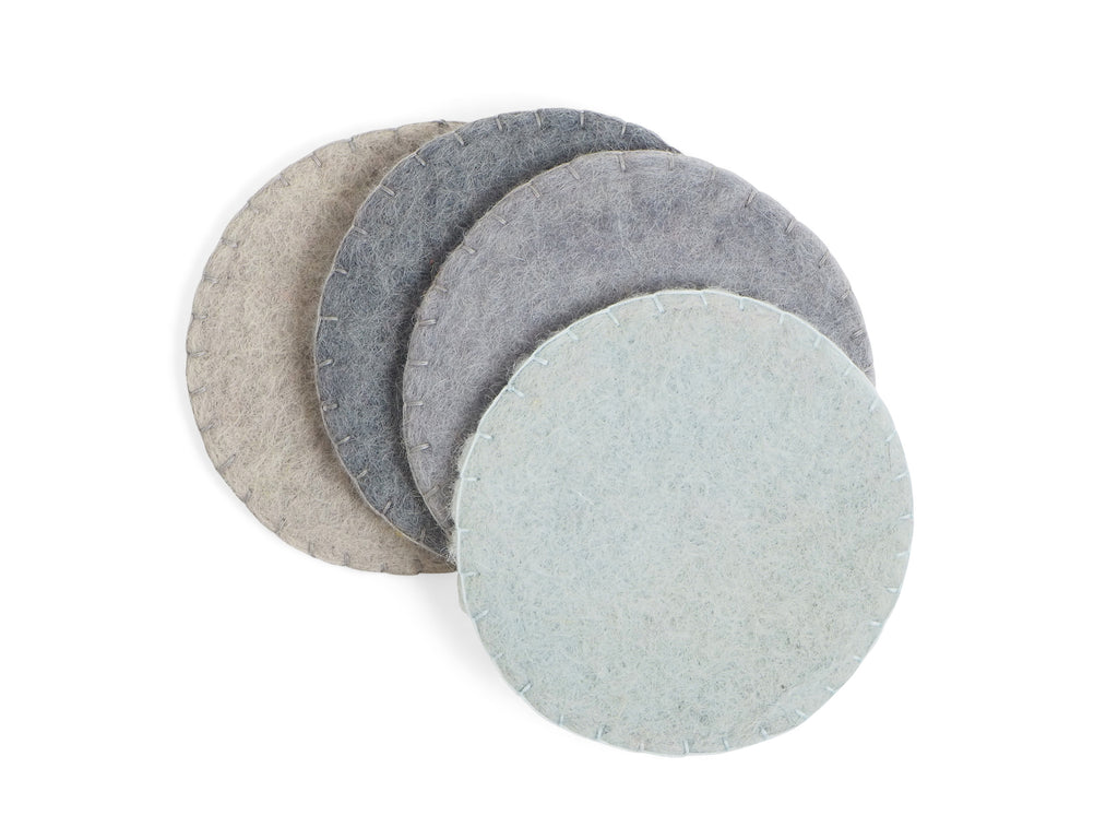 Handmade wool coasters in various shades of ocean blue.