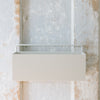 An empty white planter wall box