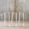 3 flutes made from clear glass. 
