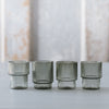 Smoke-colored mouth-blown ripple-textured shot glasses