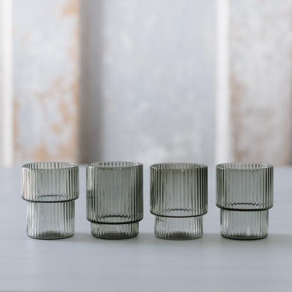 Smoke-colored mouth-blown ripple-textured shot glasses