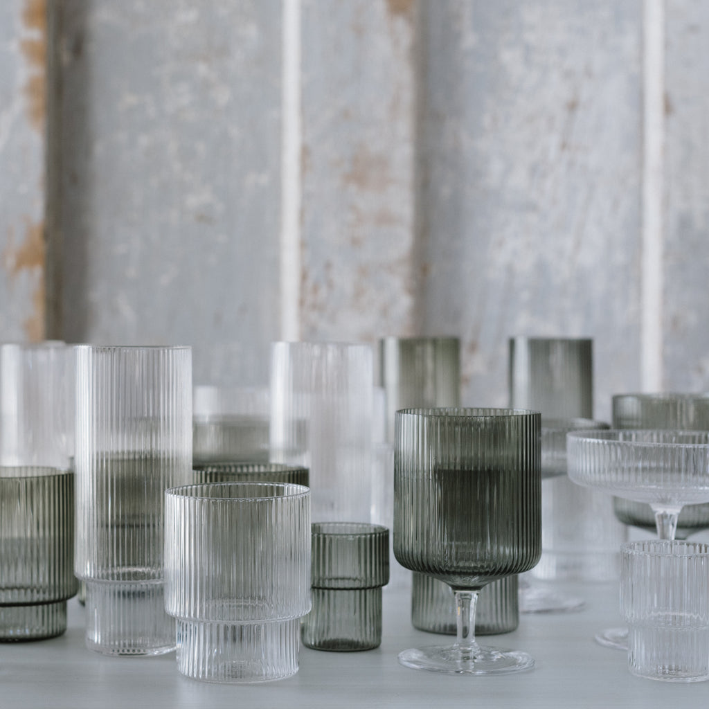 Clear and smoke-colored mouth-blown ripple-textured glasses