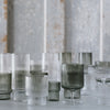 Clear and smoke-colored mouth-blown ripple-textured glasses