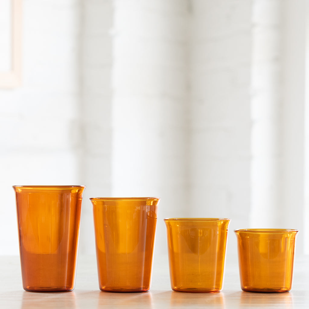 Different sizes of amber drinking glasses