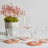 Handmade wool coasters in various shades of terracotta.
